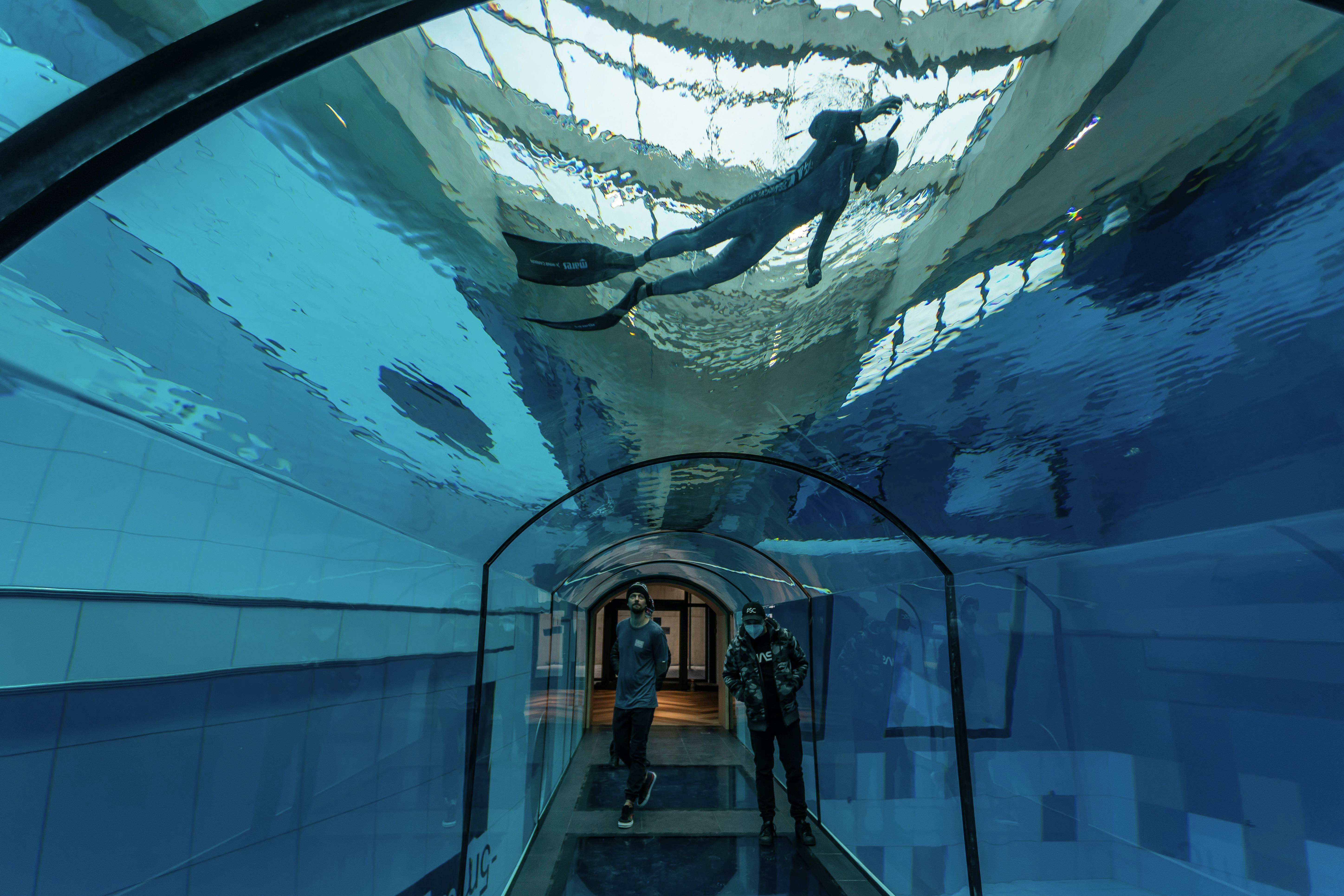 A diver is seen in the deepest pool in the world with 45.5-metre (150-foot) located in Mszczonow about 50 km from Warsaw, November 21, 2020. - The complex, named Deepspot, even includes a small wreck for scuba and free divers to explore. It has 8,000 cubic metres of water -- more than 20 times the amount in an ordinary 25-metre pool. (Photo by Wojtek RADWANSKI / AFP) (Photo by WOJTEK RADWANSKI/AFP via Getty Images)